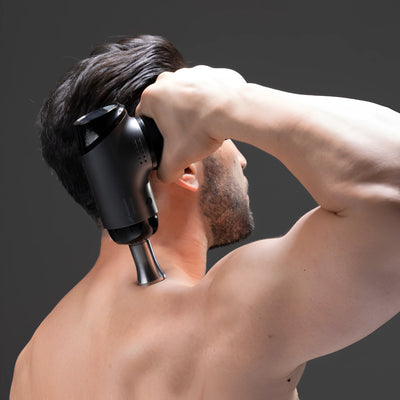 WAGNUM Massage gun being used to release arm muscle tention. 